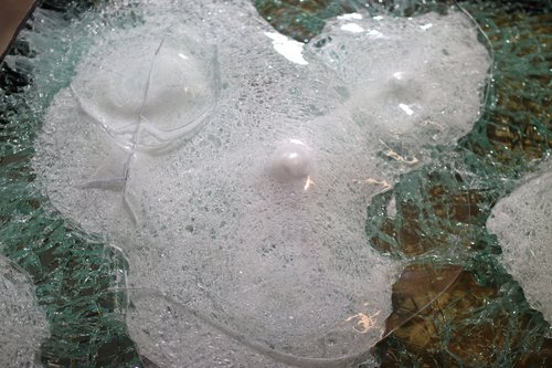Sample of bullet proof glass, damaged by three projectiles 